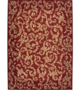 Evoking the opulence of European decor, this rug features an elegant floral scroll pattern in gold against a rich russet ground, subtly framed in burgundy. The premium wool weave imparts rich texture and indulgent softness.