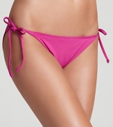 BECCA® by Rebecca Virtue gets back to basics with a classic, solid string bikini. This suit's versatility makes mixing and matching a breeze.