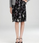 Imbue your everyday look with effortless romance in a DKNY skirt blooming with dark florals and dramatic pleats.