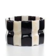 Cow horn turned chic. Handcrafted by talented Haitian artisans, this beaded stretch bracelet brings bold, organic style and new meaning to your jewelry collection in an alternating light and dark design.