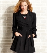 XOXO updates the classic trench coat with adorable puff sleeves and an a-line skirt of crisp pleats.