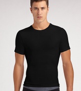 The classic crew is redefined in high-stretch cotton that firms the chest as it flattens the stomach. Crewneck Improves posture Supports lower back No bulk under clothing Tapered shape 81% cotton/19% spandex; machine wash Imported 