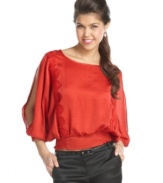 Doll-up your jeans with this XOXO blouson top that features skin-flaunting split sleeves and a cool scallop design!