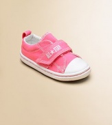 Cute, comfy classics with grip-tape closure that'll add a pop of color to any ensemble.Grip-tape closureCanvas upperCanvas liningRubber soleTraditional Chuck insoleImported