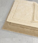 Crafted in a century-old mill in Portugal, this reversible rug offers plush tufting on one side, thick loops on the other, both luxurious underfoot.Reversible Small: 20 X 31 Large: 23 X 39 Cotton Machine wash Imported