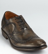 John Varvatos rocks the classic wingtip in style, rendering it in burnished calfskin and soft leather linings.