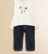 A dainty update on a regular pair of jeans in a dark-wash with slight fading and a pink seam.Front snap closureZip flyAdjustable waistband with belt loopsFive-pocket styleCottonMachine washImported
