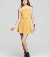 This Free People dress exudes girlish charm with a dainty crochet collar and sweet silhouette.