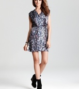Strut your stuff in this spot-on Aqua dress flaunting an abstract animal print for fiercely feminine style.