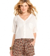 Modernize your warm-weather gear with this asymmetrical, back cutout blouse from Jessica Simpson!
