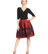 SL Fashions crafts a petite party dress featuring a flattering ruched waistline and a full, applique-embellished skirt.