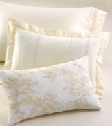 Delicate eyelet detail and lovely white embroidery add feminine charm to this soft cotton voile pillow in a buttery ivory hue.