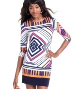 This sheath dress from Baby Phat commands all attention with its colorful geometric print and alluring back cutout.
