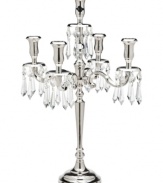 Rekindle the elegance of another era with the silver-plated candelabra from Lighting by Design. Faceted crystal beads adorn four curved arms and a center candlestick, creating instant drama in a living or dining room.