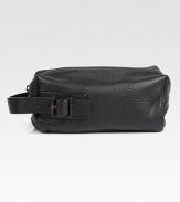 A travelers essential is enhanced by a a tonal side handle with buckle detail, finished in textured leather.Zip closureSide handleFully linedLeather10W x 5¼H x 4½DImported