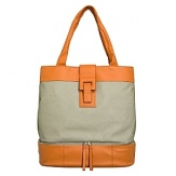 Washable coated linen tote with cowhide leather trim. Separate bottom compartment fits a pair of shoes and other travel items. Straps fit over shoulder. Interior organization pockets. Magnetic closure. Lined.