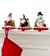 Santa's got it! Topped with a clay figurine of Father Christmas, this too-cute stocking holder keeps gifts hanging, balancing the weight on its sturdy cast iron base.