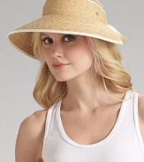 Packable wide brim raffia is accented with cotton ribbon detailing. About 4 brim Adjustable One size Spot clean Imported