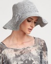 Softly textured raffia cloche, with raffia tie trim at brim, retains shape after packing.RaffiaTie detailBrim, about 4Spot cleanMade in Italy