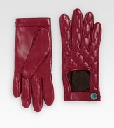 Rich leather with a chic quilted finish and classic moto styling.Top cut-out Button and snap strap Leather Dry clean by a leather specialist Imported