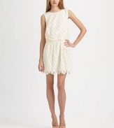 This lacy, dotted design is tailored with a prettily draped waist and a scalloped hemline.Jewel necklineSleevelessTucked front and back drapes at waistScalloped hemlineConcealed back zipAbout 17 from natural waistPolyesterDry cleanImportedModel shown is 5'9½ (176cm) wearing US size 4. 