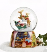Up, up and away! This snow globe captures the magic of the season with Santa Claus taking flight through a light snow to start his Christmas deliveries. The base features a lovely painted scene of two children watching Santa and the reindeer fly through the night sky.