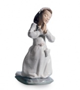 A beautiful way to commemorate your daughter or granddaughter's first communion, this artfully crafted Lladro figurine evokes the momentous occasion in glazed porcelain.