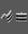 Polish, shine, and sophistication. This unique, men's cuff link style incorporates a rectangular, stainless steel setting with black resin stripes and round-cut diamonds (1/6 ct. t.w.). Approximate size: 3/4 inch x 1/2 inch.