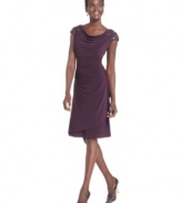 Alex Evenings' dress dazzles with beaded cap sleeves and a figure-flattering silhouette.