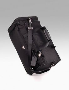 Black nylon with saffiano leather trim rolling duffel with pull-out handle and nylon shoulder strap. Lined with PRADA jacquard fabric 11½H X 21½L X 11¾W Made in Italy Black nylon with saffiano leather trim rolling duffel with pull-out handle and nylon shoulder strap. Lined with PRADA jacquard fabric 11½H X 21½L X 11¾W Made in Italy