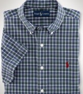 Cut for a relaxed, classic fit, a short-sleeved sport shirt is crafted from crisp cotton poplin in traditional tartan plaid for an authentic look.