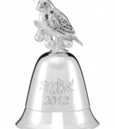 Give it a ring. Engraved for 2012, this silver Lenox bell is topped with a partridge and pears and plays The Twelve Days of Christmas.
