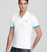 Dramatic pops of neon on the under-collar, croc logo and sleeve edge set this ultra-slim fitting Lacoste polo apart.