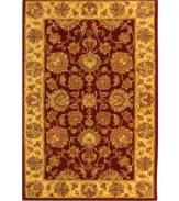 Bold colors, classic patterns. Featuring a traditional vine-and-blossom motif inspired by ancient Persian designs, this area rug from Safavieh adds a touch of drama and heirloom elegance any living space. Tufted in India from pure wool, it's sure to set just the right tone. (Clearance)