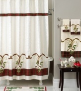 This shower curtain lends festive charm to the bath. A cheerful holly and plaid ribbon motif dances along an off-white ground.