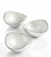 Full of surprises, these handcrafted nut bowls from the Simply Designz collection of serveware and serving dishes feature sleek, polished aluminum lined with scalloped ivory enamel. An elegant set for serving snacks or simply decorating the table.