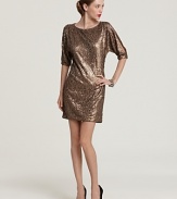 Gilded in shimmering sequins, this undeniably glam Trina Turk dress flaunts slit sleeves for a tasteful peek of skin.