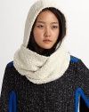 This nubby cotton knit wraps around the head and shoulders as a cozy topper to any outfit.Cotton Dry clean Imported