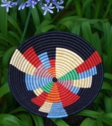 Bold, colorful and intriguingly abstract, the New Africa Fruit Bowl is true modern art. Brightly colored wedges of varying sizes and shapes emanate out from the center of the bowl, symbolizing the women of Rwanda reaching across the boundaries of gender and geography to positively impact thousands of lives-from the weavers who make the baskets to the customers whose lives are enriched by their art.