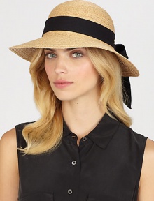 Fine braided raffia accented with polka dot ribbon trim can be worn with brim turned up or rolled down. Bow at back Adjustable sizing cord Brim, about 3½ Imported