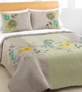 Petal perfect. Floral appliqués and intricate embroidery embellish soft quilting for a look that's at once carefree and decidedly feminine. The Bohemia quilt features both a lustrous solid and a printed circle pattern. Reverses to solid. (Clearance)