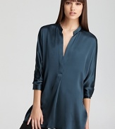 Fashioned in shimmering silk, this Vince tunic layers over your favorite skinnies for effortless chic.