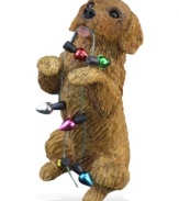 A fetching gift for animal lovers, the golden retriever Christmas ornament depicts a doe-eyed pup eager to deck the halls. From Sandicast.