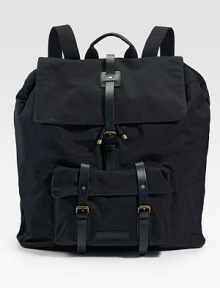 A utility design with city sophistication in rugged cotton canvas. A roomy, hold-everything backpack is finished with leather straps that hold everything together. Adjustable shoulder straps Top handle Drawstring closure Exterior front pocket Interior zip pocket Cotton 18W X 20½H X 5½D Imported 