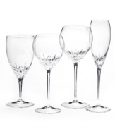 Inspired by the chic London neighborhood, Wedgwood Knightsbridge stemware features a delicately round shape with deep cuts around the bowl. The stem resembles a flower when viewed from above. Flute shown far right.