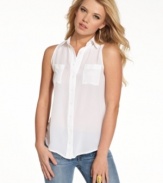 Don easygoing luxe with this silk button-down blouse from GUESS? -- a smart, minimalist companion to your skinny jeans!