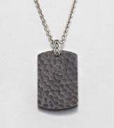 From the Palu Collection. The hand-hammered design motif of the Palu collection distinguishes a blackened bronze dog tag pendant, connected by a sterling silver bale to a bold chain of bright stainless steel.Bronze and sterling silverStainless steelChain length, about 24Pendant, about 2L X 1WLobster claspMade in Bali