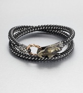 From the Naga Collection. A bold, braided strand of black nylon cord wraps the wrist twice, then clasps with a woven bronze ring and a Naga dragon hook of sterling silver.NylonSterling silver and bronzeStrap width, about .25Diameter, about 2.5Hook-and-ring closureMade in Bali