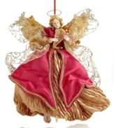 A soothing presence throughout the season, this Holiday Lane angel ornaments your tree with wings of shimmering gold and festive red. Her sparkling harp sets the tone for every holiday.