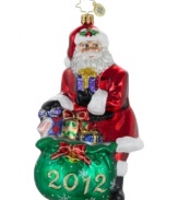 Wrap up the year with good cheer. Santa stuffs a few extra packages in his gift bag, made special for the 2012 holiday in mouth-blown glass by Christopher Radko.